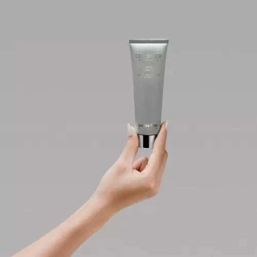 Swissline Smart Cream Mat 50ml tube held in hand