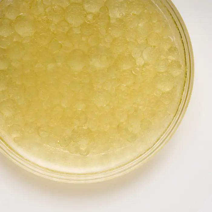 Close-up of rich creamy shea butter hair mask texture for dry frizzy hair