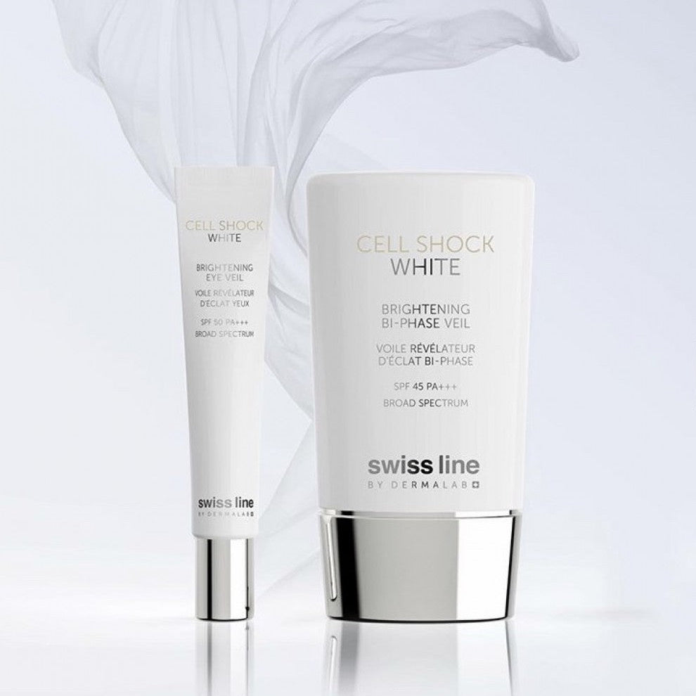 Swissline Brightening Eye Veil SPF 50 tube next to Brightening Bi-Phase Veil bottle on reflective surface