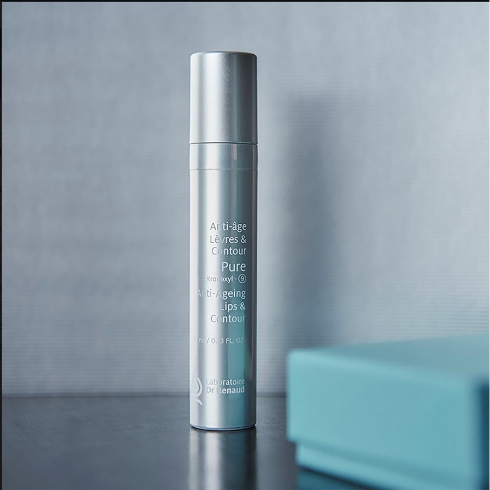 PURE Kronoxyl-9 anti-aging lip and contour care bottle displayed on a neutral grey background