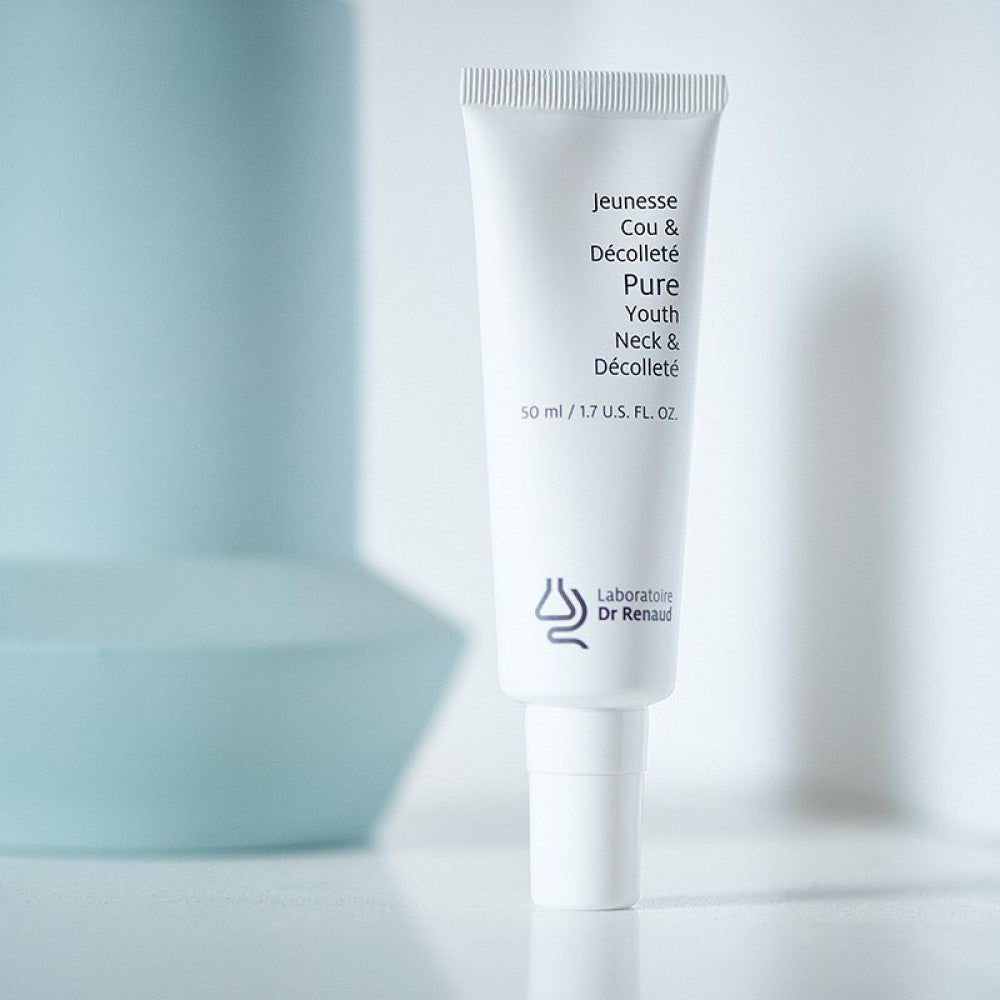 PURE Youth Neck and Décolleté cream tube by Laboratoire Dr Renaud displayed on a minimal light background