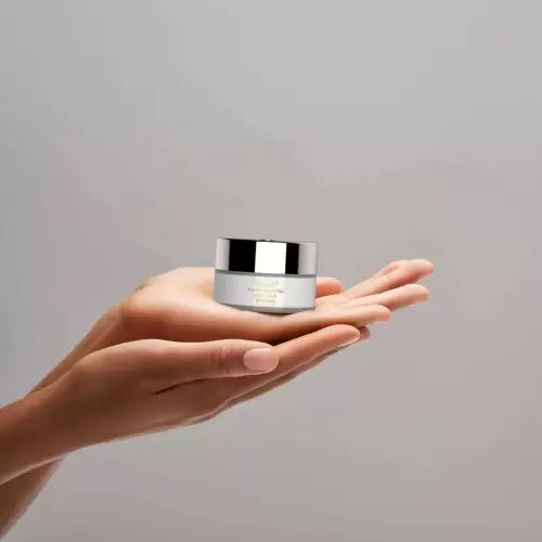 Swissline Youth-Inducing Eye Cream 15ml jar held in hand